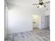 This bedroom has gray vinyl floors and is connected to the bathroom at 10772 N Biznaga St, Florence, AZ 85132