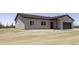Exterior elevation showcasing the home's front facade with ample desert surroundings at 10772 N Biznaga St, Florence, AZ 85132