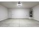 Spacious garage features a door to interior of home at 10772 N Biznaga St, Florence, AZ 85132