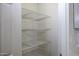 This walk-in pantry offers plenty of storage space with its wire shelving at 10772 N Biznaga St, Florence, AZ 85132