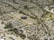 Aerial view of a desert property outlined in yellow, featuring a single-Gathering home and expansive surrounding area at 10772 N Biznaga St, Florence, AZ 85132