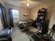 Bedroom with a ceiling fan, window, and Batman poster at 1309 E Julie Ct, San Tan Valley, AZ 85140