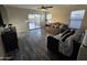 Cozy living room with hardwood floors, sliding glass doors to the backyard, and lots of natural light at 1309 E Julie Ct, San Tan Valley, AZ 85140