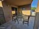 Covered patio with round glass table and chairs at 1309 E Julie Ct, San Tan Valley, AZ 85140