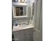 Clean and bright bathroom featuring a marble vanity, modern fixtures, and mosaic tile backsplash at 1417 E Century Ave, Gilbert, AZ 85296