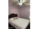 Cozy bedroom features a ceiling fan, comfortable bed, and soft natural light at 1417 E Century Ave, Gilbert, AZ 85296