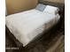 Cozy bedroom with a rustic bed frame, plush mattress, and comfortable rug flooring at 1417 E Century Ave, Gilbert, AZ 85296