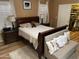 Bright bedroom with hardwood floors, stylish decor, and access to a walk-in closet at 1417 E Century Ave, Gilbert, AZ 85296