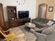 Spacious living room offering comfortable seating and natural light with hardwood flooring at 1417 E Century Ave, Gilbert, AZ 85296