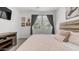 Cozy bedroom featuring a comfortable bed, neutral tones, and framed art for a relaxing atmosphere at 14870 W Encanto Blvd # 1059, Goodyear, AZ 85395