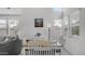Bright dining area with white walls, wood table, and large windows providing ample natural light at 14870 W Encanto Blvd # 1059, Goodyear, AZ 85395