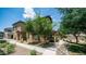 Attractive exterior with mature trees, walkway, and well-maintained landscaping at 14870 W Encanto Blvd # 1059, Goodyear, AZ 85395