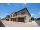 Exterior view of townhome with two-car garage and desert landscaping at 14870 W Encanto Blvd # 1059, Goodyear, AZ 85395