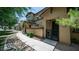 Charming two-story home featuring a private gated front yard and walkway at 14870 W Encanto Blvd # 1059, Goodyear, AZ 85395