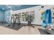 Community gym featuring weight machines, a rack, a mat and large windows at 14870 W Encanto Blvd # 1059, Goodyear, AZ 85395