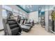 Well-equipped gym with multiple machines, mirrors, and ample natural light at 14870 W Encanto Blvd # 1059, Goodyear, AZ 85395