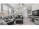 Bright living room with large windows, comfortable seating, and stylish decor, creating a cozy atmosphere at 14870 W Encanto Blvd # 1059, Goodyear, AZ 85395