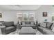 Comfortable living room featuring neutral furniture and soft lighting at 14870 W Encanto Blvd # 1059, Goodyear, AZ 85395