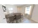 Sunlit dining room features seating for six and a modern area rug at 15505 W Corte Del Sol Este --, Waddell, AZ 85355