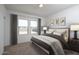 Modern bedroom with large windows and gray accents, creating a soothing and stylish space at 15508 W Corte Del Sol Este --, Waddell, AZ 85355