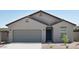 Charming single-story home with a two-car garage and neutral-toned stucco exterior at 15508 W Corte Del Sol Este --, Waddell, AZ 85355