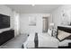 This primary bedroom boasts neutral decor, carpeted floor and private ensuite at 15512 W Corte Del Sol Este --, Waddell, AZ 85355