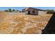 Expansive backyard featuring a covered patio and ample space, ideal for creating an outdoor oasis at 1630 E Prickly Pear Pl, Casa Grande, AZ 85122