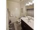 Bright bathroom featuring a vanity with a large mirror and a shower with a decorative curtain at 1630 E Prickly Pear Pl, Casa Grande, AZ 85122