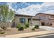 Charming single-story home featuring a well-maintained front yard with desert landscaping and an attached garage at 1630 E Prickly Pear Pl, Casa Grande, AZ 85122