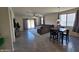 Open-concept living room featuring plenty of natural light and tile flooring, seamlessly connecting dining and living spaces at 1630 E Prickly Pear Pl, Casa Grande, AZ 85122