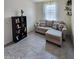Comfortable living room featuring neutral paint, modern tile flooring, and plenty of natural light at 1630 E Prickly Pear Pl, Casa Grande, AZ 85122