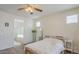 Comfortable bedroom featuring neutral walls, a ceiling fan, and an ensuite bathroom at 16526 W Calle Lejos --, Surprise, AZ 85387
