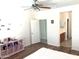 Cozy bedroom showcasing a ceiling fan, a playful decor, and easy access to an ensuite bathroom at 16526 W Calle Lejos --, Surprise, AZ 85387