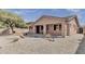 Charming single-story home with desert landscaping in front and a covered porch perfect for outdoor relaxation at 16526 W Calle Lejos --, Surprise, AZ 85387