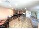 Spacious kitchen boasts stainless appliances, a breakfast bar, and an adjacent dining area at 16526 W Calle Lejos --, Surprise, AZ 85387