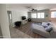 Spacious living room with ample natural light, ceiling fan and modern furniture at 16526 W Calle Lejos --, Surprise, AZ 85387