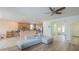 Well-lit living area featuring a neutral color palette, ceiling fan and open kitchen access at 16526 W Calle Lejos --, Surprise, AZ 85387