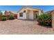 Low maintenance backyard with desert landscaping and covered patio at 16827 S 20Th Way, Phoenix, AZ 85048