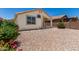 Low-maintenance backyard with desert landscaping and covered patio at 16827 S 20Th Way, Phoenix, AZ 85048