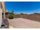 Enclosed backyard featuring desert landscaping, a brick wall, and clear blue sky at 16827 S 20Th Way, Phoenix, AZ 85048