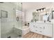 Stylish bathroom with a soaking tub, glass-enclosed shower, and double vanity for a spa-like experience at 16827 S 20Th Way, Phoenix, AZ 85048