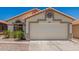 Charming single-story home with a two-car garage and well-maintained landscaping at 16827 S 20Th Way, Phoenix, AZ 85048