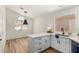 Bright kitchen features white cabinets, quartz countertops, and stainless steel sink at 16827 S 20Th Way, Phoenix, AZ 85048