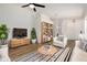 Stylish living room with neutral tones, modern furnishings and a ceiling fan at 16827 S 20Th Way, Phoenix, AZ 85048