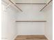 A walk-in closet with rods provides ample storage for clothing and accessories at 16827 S 20Th Way, Phoenix, AZ 85048