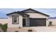 Charming single-story home with a modern exterior, neutral color palette, and well-manicured landscaping at 18243 W La Senda Dr, Surprise, AZ 85387