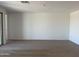 Spacious living area with wood-look tile floors at 18243 W La Senda Dr, Surprise, AZ 85387