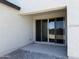 Covered patio with sliding glass doors at 18243 W La Senda Dr, Surprise, AZ 85387