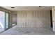 Unfinished living room with drywall, concrete floor, and sliding glass door at 18260 W Camino De Oro --, Surprise, AZ 85387