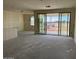 Unfinished living area with concrete floors and a large sliding glass door at 18260 W Camino De Oro --, Surprise, AZ 85387